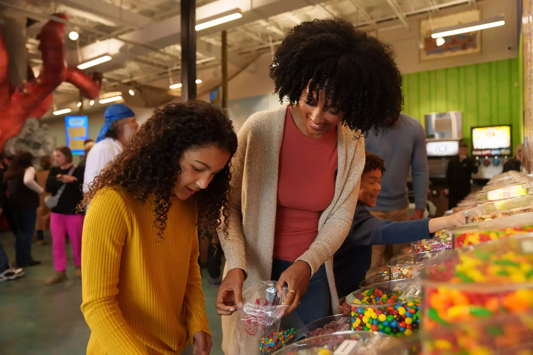 Mother and daughter getting candy