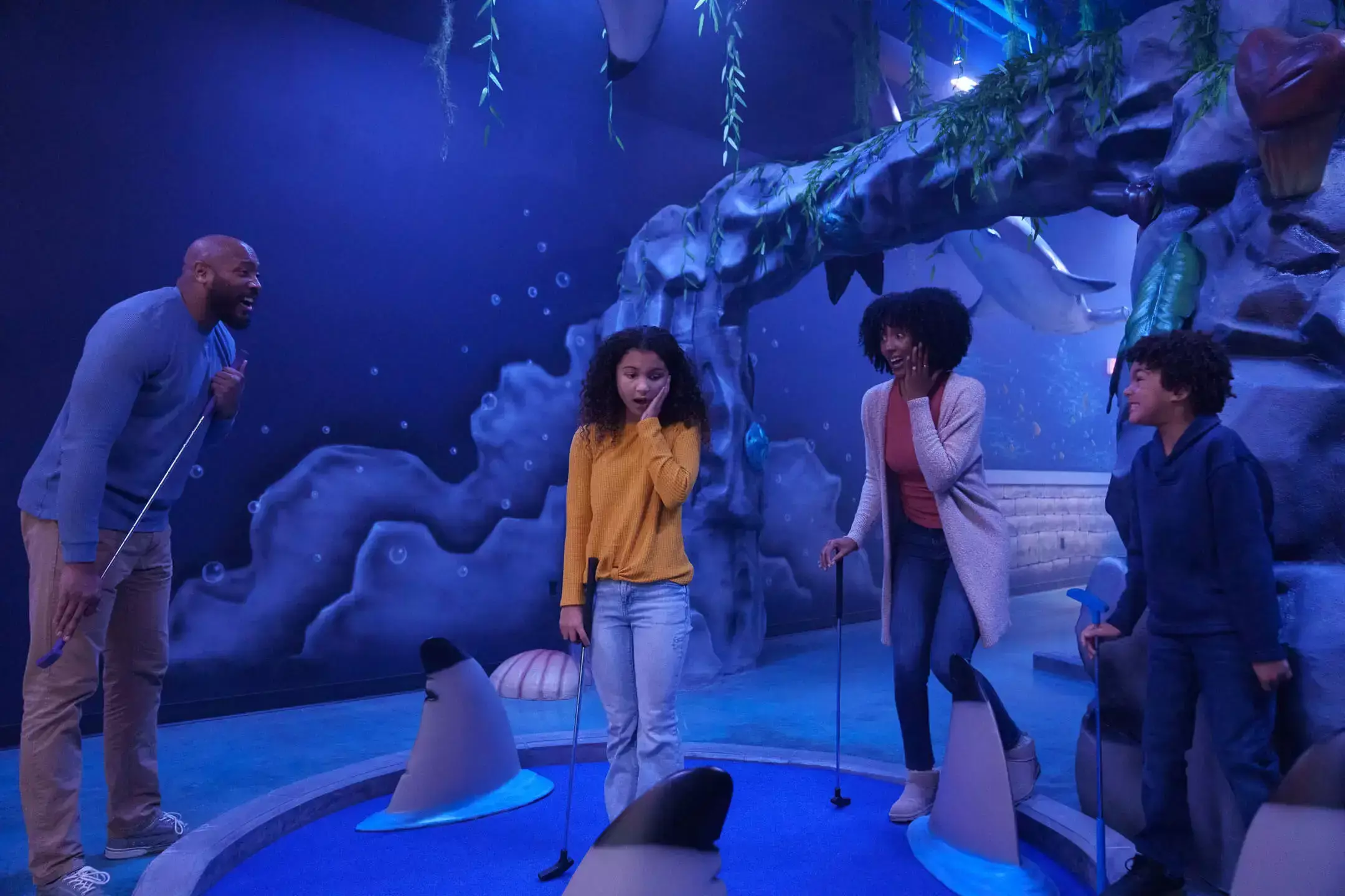 family on the mermaid course indoors